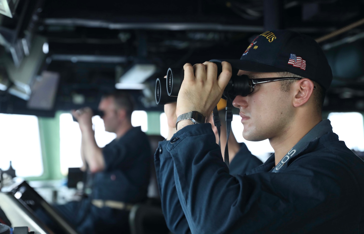 TAIWAN STRAIT (April 16, 2023) – Ensign Zachary Bradberry, from Pflugerville, Texas, stands watch on the bridge aboard the Arleigh Burke-class guided-missile destroyer USS Milius (DDG 69) while conducting a Taiwan Strait transit. Milius is assigned to Commander, Task Force 71/Destroyer Squadron (DESRON) 15, the Navy’s largest forward-deployed DESRON and the U.S. 7th Fleet’s principal surface force. (U.S. Navy photo by Mass Communication Specialist 1st Class Greg Johnson)