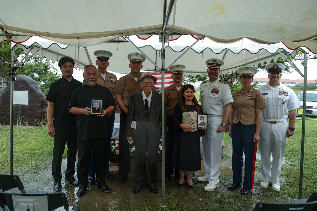 U.S. service members and distinguished guests pose for a photo during the Ishigaki Memorial Ceremony on Ishigaki, Okinawa, Japan, April 15, 2023. The ceremony honors three fallen World War II U.S. Navy airmen, whom died shortly after crash landing on the island. The memorial was developed by the people of Ishigaki and U.S. Service members as a symbol of peace and friendship. (U.S. Marine Corps photo by Sgt. Megan Roses)