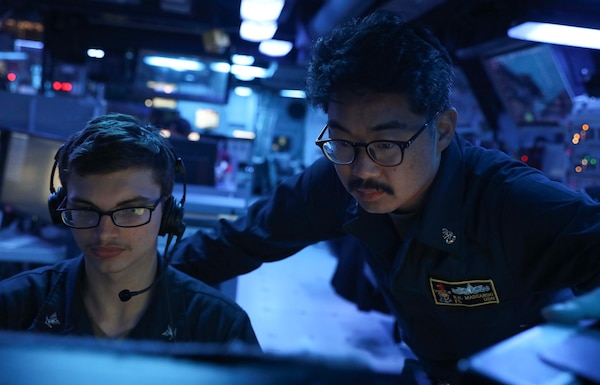 TAIWAN STRAIT (April 17, 2023) – Fire Controlman (Aegis) 3rd Class Bryce Connolly, left, from Phoenix, and Chief Fire Controlman Richard Mascardo, from San Diego, stand watch in the combat information center aboard the Arleigh Burke-class guided-missile destroyer USS Milius (DDG 69) while conducting a Taiwan Strait transit. Milius is assigned to Commander, Task Force 71/Destroyer Squadron (DESRON) 15, the Navy’s largest forward-deployed DESRON and the U.S. 7th Fleet’s principal surface force. (U.S. Navy photo by Mass Communication Specialist 1st Class Greg Johnson)