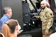 U.S. Army Warrant Officer Dejour Hughes, a UH-60 Black Hawk helicopter pilot with the 28th Expeditionary Combat Aviation Brigade, demonstrates cockpit instruments to civilian first responders at the Covington Independent Fire Company, April 15th 2023. Civil-military outreach engagements like this are designed to promote a stronger bilateral relationship with first responders and teach them unique circumstances in responding to military accidents. (U.S. Army National Guard photo by Spc. Glenn Brennan)