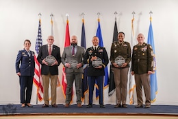 Service members hold awards