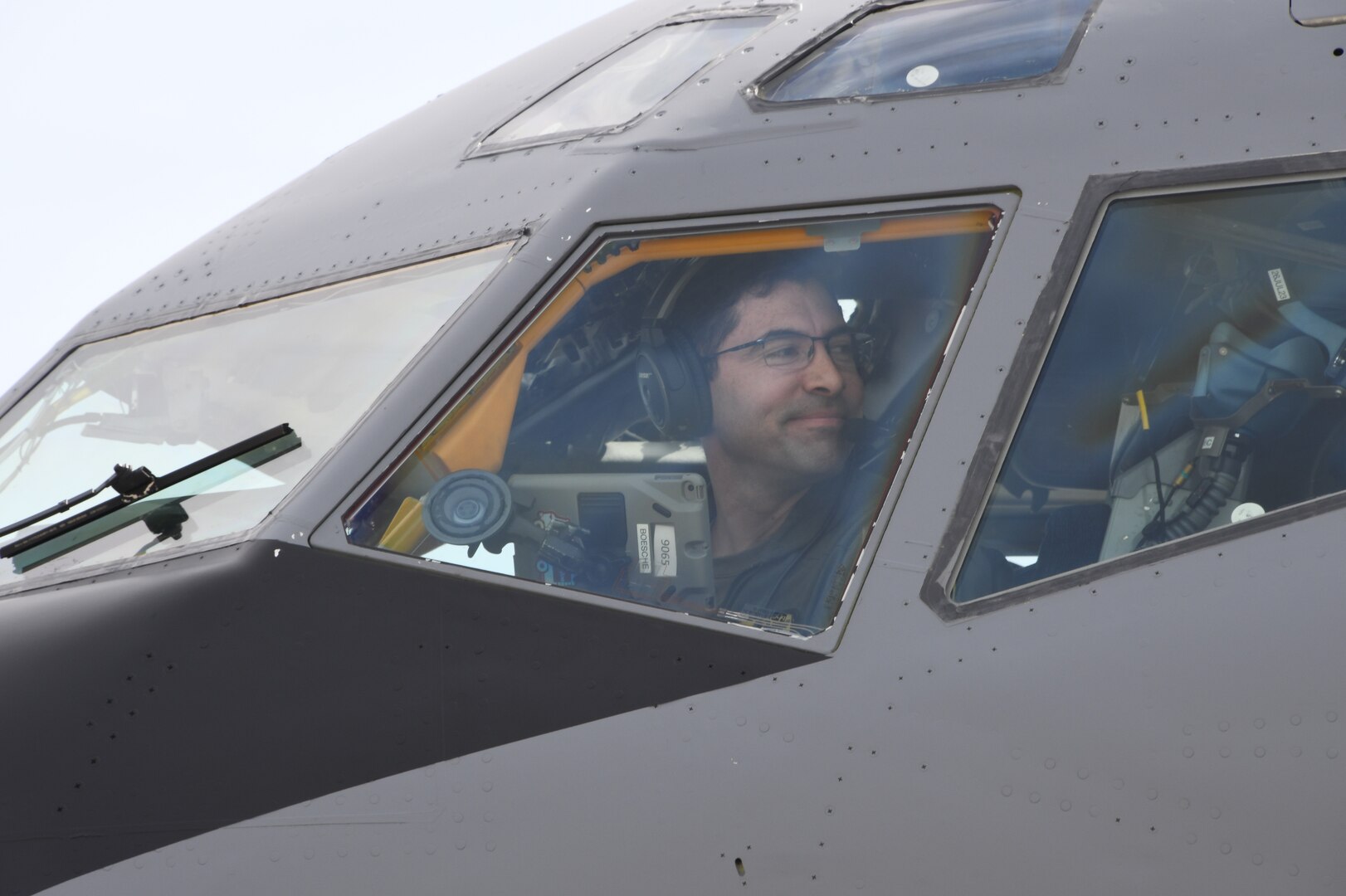 Lt. Col. Jeffrey Boesche of the 168th Wing looks out the window of a KC-135 Stratotanker as he checks engines during preflight inspections during a multiday flyaway readiness exercise at Volk Field, Wisconsin, April 1-7, 2023.