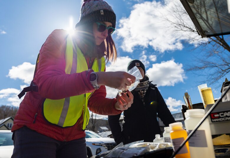 Andi Fitzgibbon, a biologist with the U.S. Army Corps of Engineers Pittsburgh District’s Water Quality team, uses a lugol solution to preserve algae samples at a mobile testing apparatus near Warren, Pennsylvania, March 30, 2023. The district’s Water Quality team collected water samples from the Allegheny River both before and after the spring pulse to compare the pulse’s effect along various points on the river. The collected samples are sent to the Corps of Engineers Research and Development Center to test and analyze myriad factors such as pH acidity, alkalinity, metals, nutrients, and conductivity. (U.S. Army Corps of Engineers Pittsburgh District photo by Andrew Byrne)