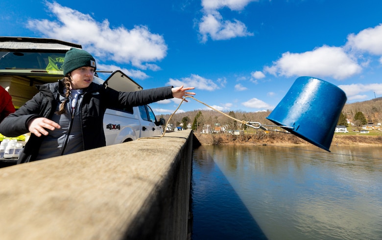Destinee Davis, a biologist with the U.S. Army Corps of Engineers Pittsburgh District’s Water Quality team, collects a water sample on a bridge in West Hickory, Pennsylvania, March 30, 2023. The district’s Water Quality team collected water samples from the Allegheny River both before and after the spring pulse to compare the pulse’s effect along various points on the river. The collected samples are sent to the Corps of Engineers Research and Development Center to test and analyze myriad factors such as pH acidity, alkalinity, metals, nutrients, and conductivity. (U.S. Army Corps of Engineers Pittsburgh District photo by Andrew Byrne)