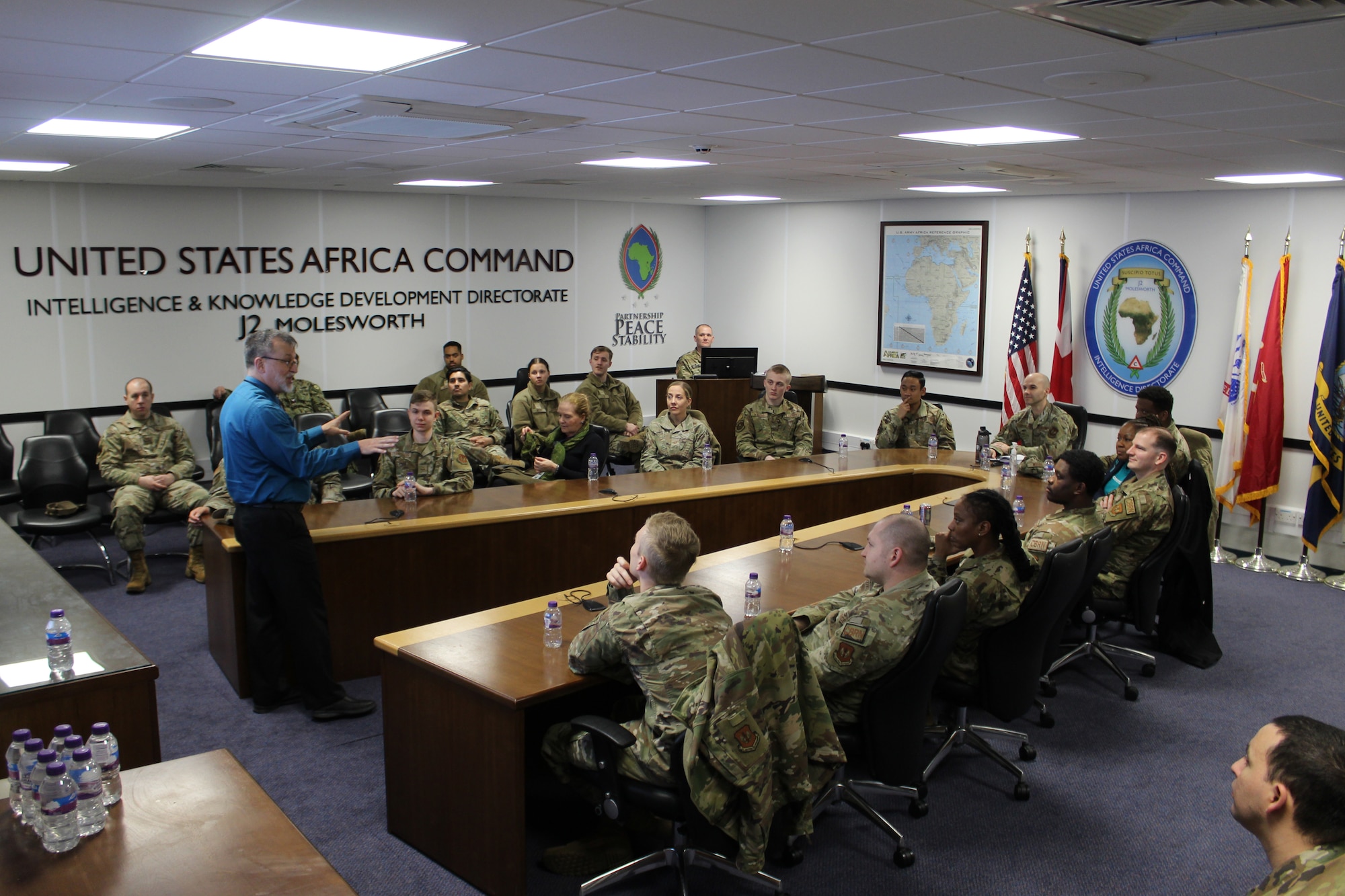 Thomas "Tony" Gendron, Joint Intelligence Command U.S. Africa Command operations officer and program manager, briefs the 501st Combat Support Wing Airmen during the AFRICOM brief at RAF Molesworth, England, April 5, 2023. The 501st CSW Readiness Working Group partnered with JICAF to familiarize Wing Airmen with the joint intelligence mission and AFRICOM. (U.S. Air Force photo by Staff Sgt. Jennifer Zima)