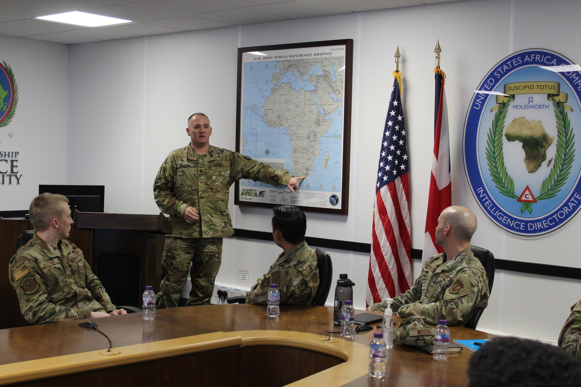 U.S. Army Sgt. 1st Class Michael Wurzer, Joint Intelligence Command U.S. Africa Command noncommissioned officer in charge of operations, briefs the 501st Combat Support Wing Airmen during the AFRICOM brief at RAF Molesworth, England, April 5, 2023. The 501st CSW Readiness Working Group partnered with JICAF to familiarize Wing Airmen with the joint intelligence mission and AFRICOM. (U.S. Air Force photo by Staff Sgt. Jennifer Zima)