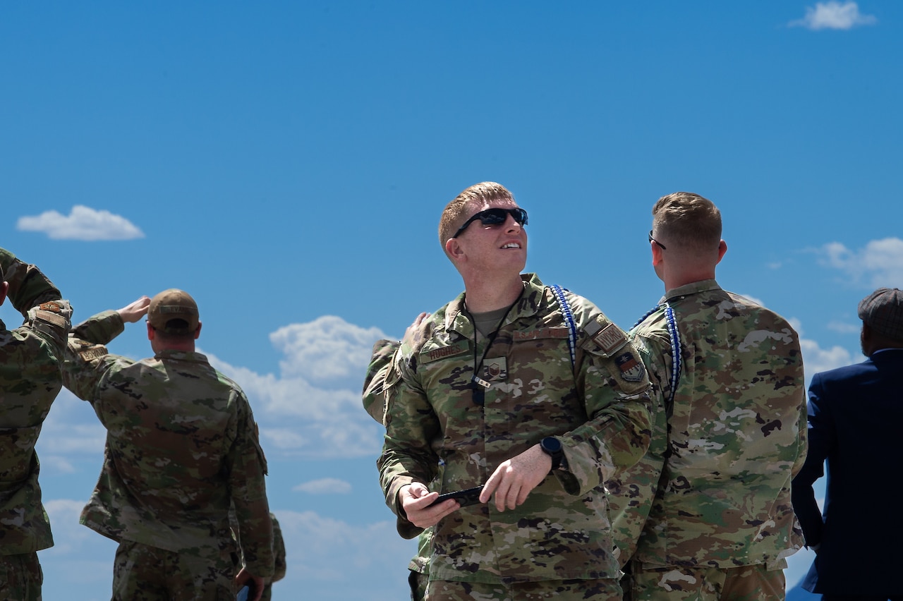 Cadets look up toward the sky.