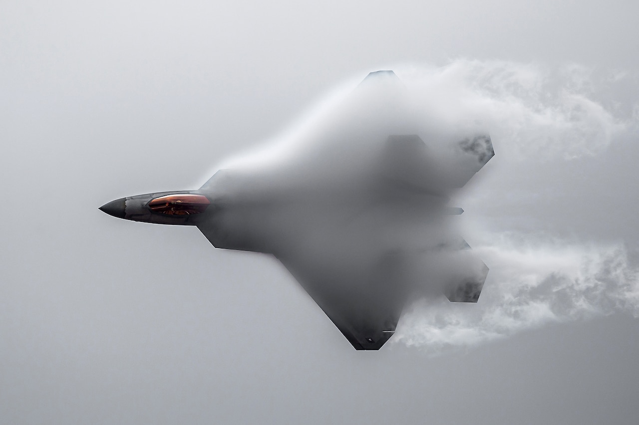 An aircraft flies through clouds.