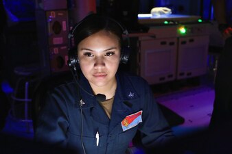 Operations Specialist 3rd Class Savannah Valdez, from San Diego, stands watch in the Combat Information Center aboard Arleigh Burke-class guided-missile destroyer USS Benfold (DDG 65) during a trilateral ballistic missile defense exercise with Japan Maritime Self-Defense Force guided-missile destroyer JS Atago (DDG 177) and Republic of Korea Navy Sejong the Great-class destroyer ROKS Yulgoki I (DDH 992).