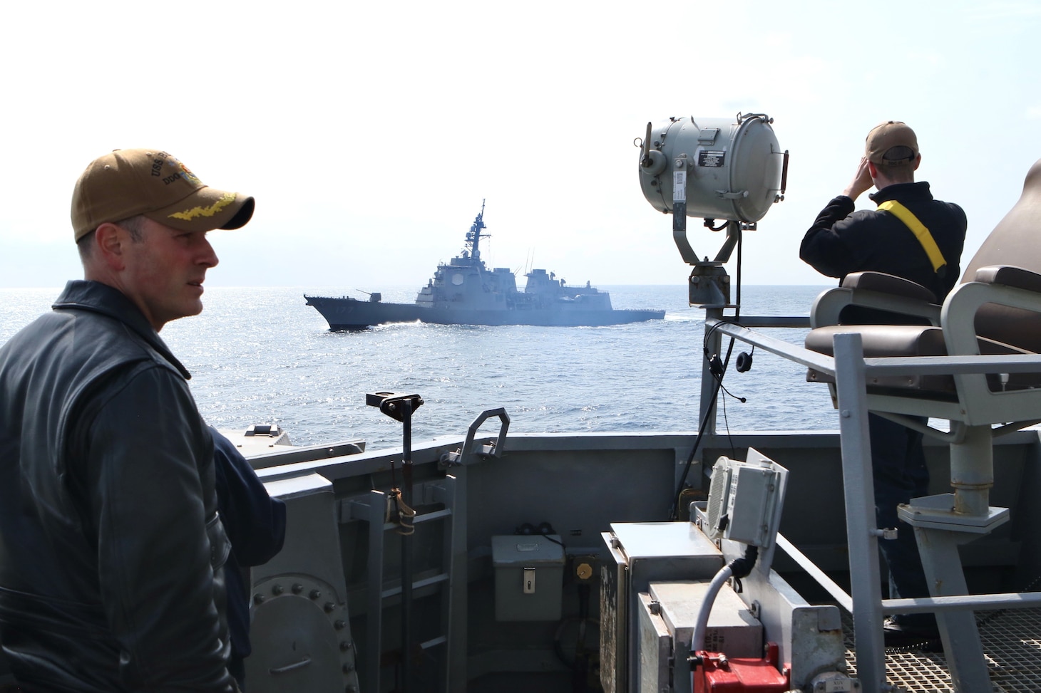 Cmdr. Marcus Seeger, commanding officer of Arleigh Burke-class guided-missile destroyer USS Benfold (DDG 65), directs close-in ship maneuvers alongside Japan Maritime Self-Defense Force guided-missile destroyer JS Atago (DDG 177) and Republic of Korea Navy Sejong the Great-class destroyer ROKS YulGok Yi I (DDG 992) during a trilateral maritime exercise focused on ballistic missile defense integration and shipboard maneuvers. Benfold is underway in the U.S. 7th Fleet area of operations as part of Destroyer Squadron 15. U.S. 7th Fleet is the U.S. Navy‘s largest forward-deployed numbered fleet, and routinely interacts and operates with allies and partners in preserving a free and open Indo-Pacific region. (U.S. Navy photo by Seaman Alexis Pelletier)