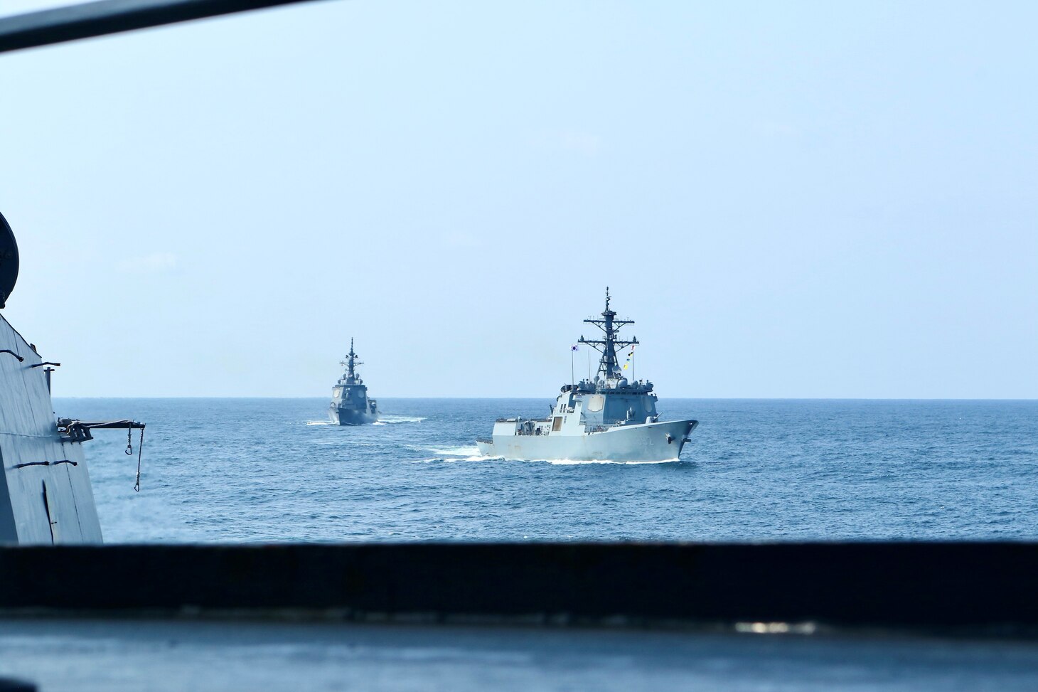 Japan Maritime Self-Defense Force guided-missile destroyer JS Atago (DDG 177) and Republic of Korea Navy Sejong the Great-class destroyer ROKS YulGok Yi I (DDG 992) steam alongside the Arleigh Burke-class guided-missile destroyer USS Benfold (DDG 65) during a trilateral maritime exercise focused on ballistic missile defense integration and shipboard maneuvers. Benfold is underway in the U.S. 7th Fleet area of operations as part of Destroyer Squadron 15. U.S. 7th Fleet is the U.S. Navy‘s largest forward-deployed numbered fleet, and routinely interacts and operates with allies and partners in preserving a free and open Indo-Pacific region. (U.S. Navy photo by Seaman Alexis Pelletier)