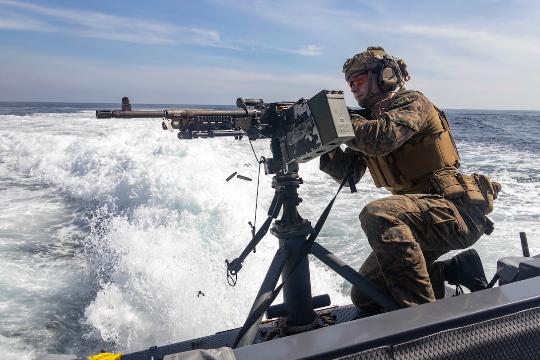 A U.S. Marine with Maritime Raid Platoon, 13th Marine Expeditionary Unit, fires an M240B machine gun from an 11-meter rigid-hull inflatable boat during a machine gun range, Jan. 11. The 13th Marine Expeditionary Unit is embarked on the Makin Island Amphibious Ready Group, comprised of amphibious assault ship USS Makin Island (LHD 8) and amphibious transport dock ships USS John P. Murtha (LPD 26) and USS Anchorage (LPD 23), and operating in the U.S. 7th Fleet area of operations. 7th Fleet is the U.S. Navy's largest forward-deployed numbered fleet, and routinely interacts and operates with Allies and partners in preserving a free and open Indo-Pacific region.