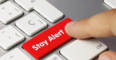 Image of a keyboard with the Enter button being read and stating Stay Alert.