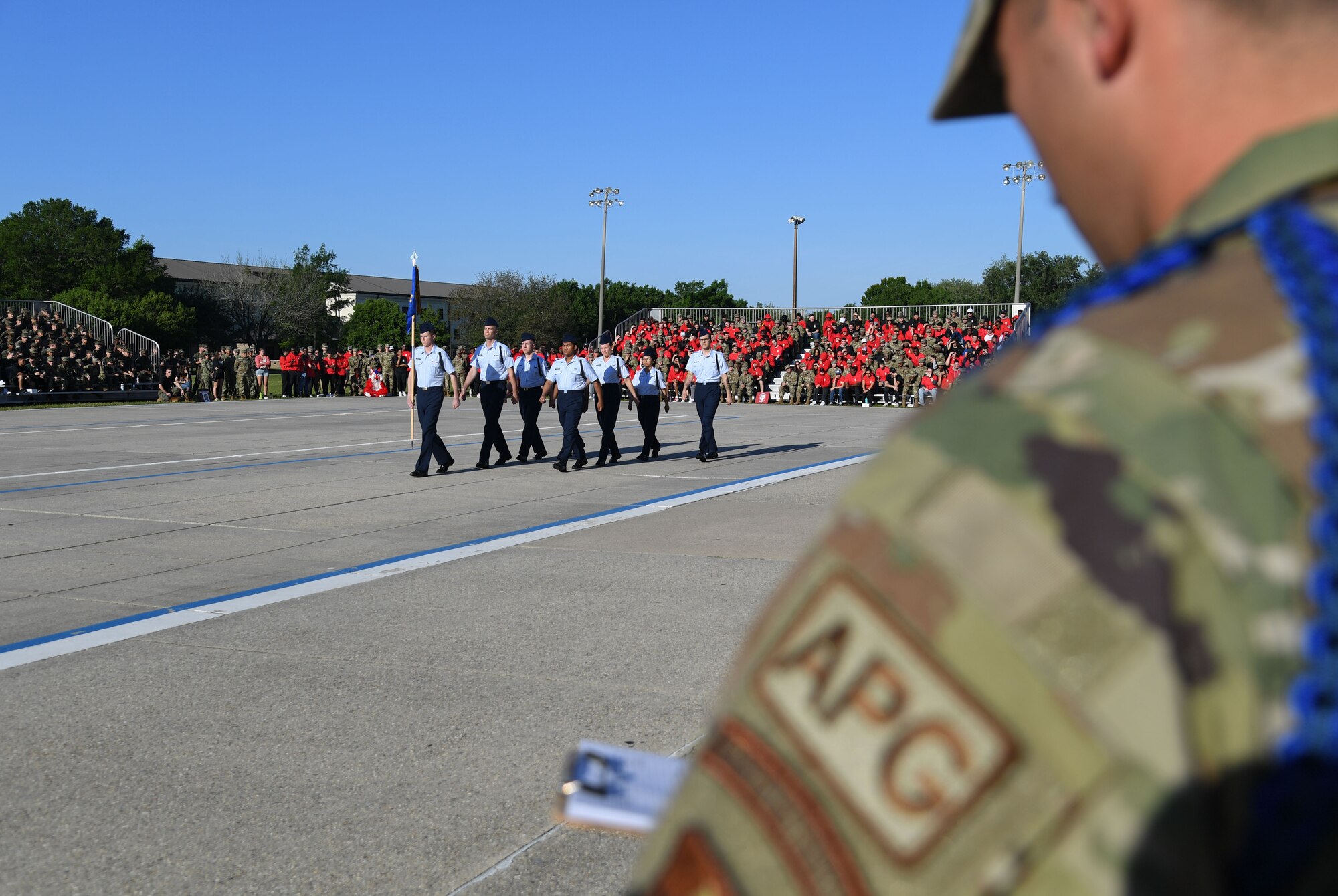 U.S. Air Force Tech. Sgt. Nicholas Holguin, 81st Training Support Squadron military training leader instructor, scores the 334th Training Squadron regulation drill team during the 81st Training Group drill down on the Levitow Training Support Facility drill pad at Keesler Air Force Base, Mississippi, April 14, 2023.