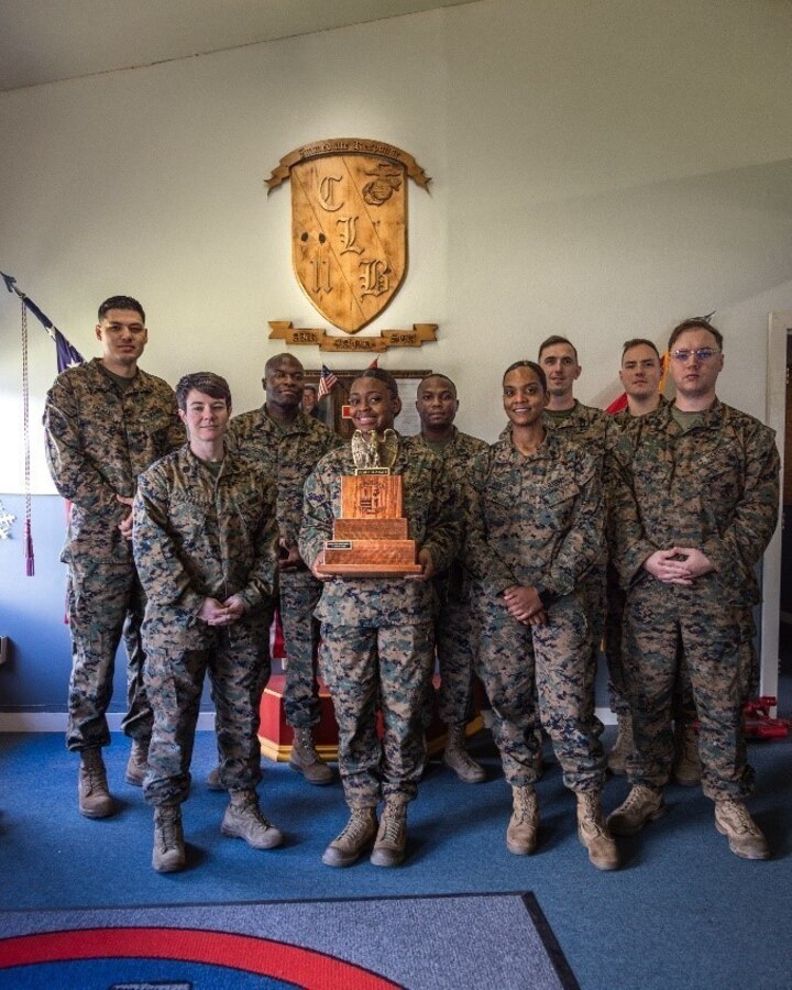 U.S. Marines with Combat Logistics Battalion 11, 1st Marine Logistics Group pose with the trophy from the first “Fight Tonight” award at Combat Logistics Battalion 11. After careful consideration, CLB 11 narrowly edged out the competition for the distinction as the unit most ready for crises, contingencies, and combat operations in the 1st quarter of FY23. The commanding general selected CLB 11 based on a wholistic concept of readiness which includes the easily measurable aspects of individual, equipment, and training readiness, but it also includes the less measurable aspects that multiply a unit's combat effectiveness like cohesion, esprit de corps, trust up and down the chain of command, and individual discipline and integrity. The 1st MLG “Fight Tonight” award is part of the 1st MLG’s commitment to provide a logistical force capable of fighting on a moment’s notice. (U.S. Marine Corps photo by Sgt. Aldo Sessarego)