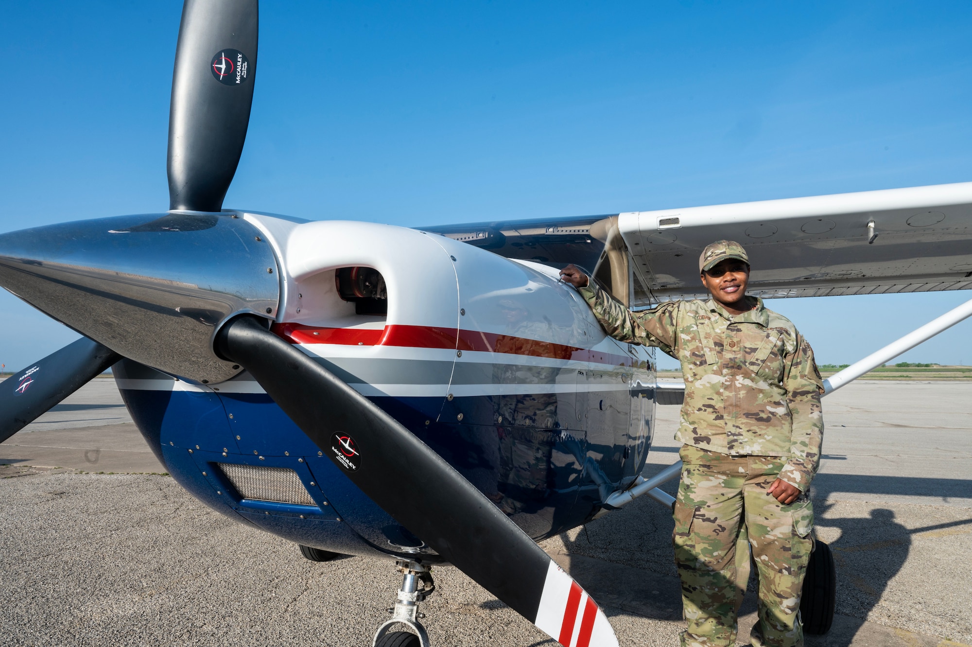 Master Sgt. Careen Lewis, 7th Equipment Maintenance Squadron fabrication flight superintendent, poses for a photo after conducting a pre-flight check of a Cessna 182T