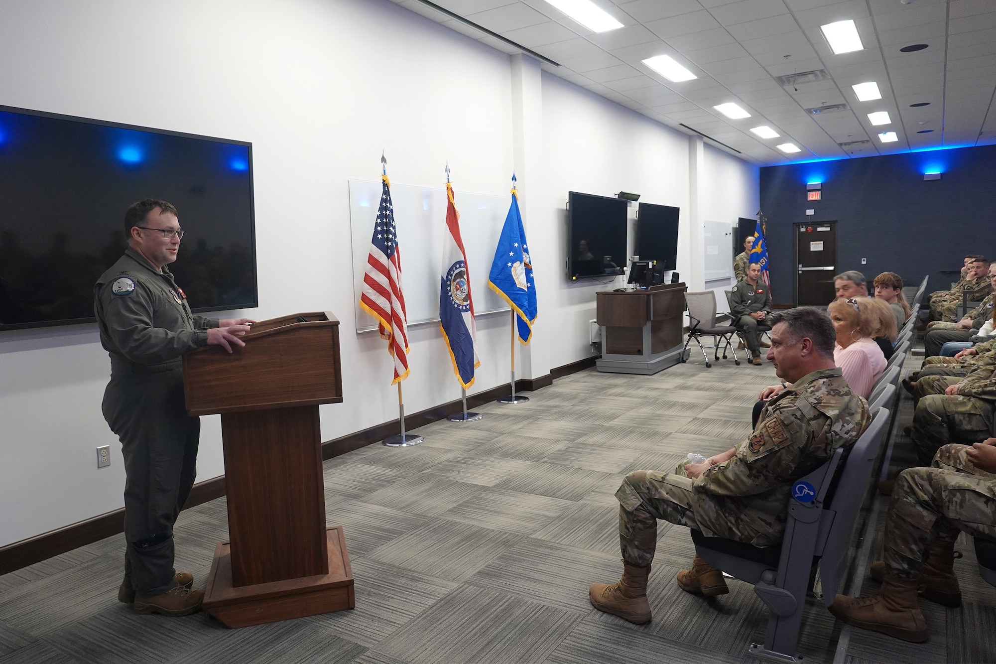 Col. Jared Kennish, 131st Bomb Wing commander, delivers remarks during an assumption of command ceremony for Lt. Col. Matthew Howard, incoming 131st Operations Group commander, April 2, 2023, at Whiteman Air Force Base, Missouri. Howard previously served as the 110th Bomb Squadron commander. (U.S. Air National Guard photo by Airman 1st Class Phoenix Lietch)