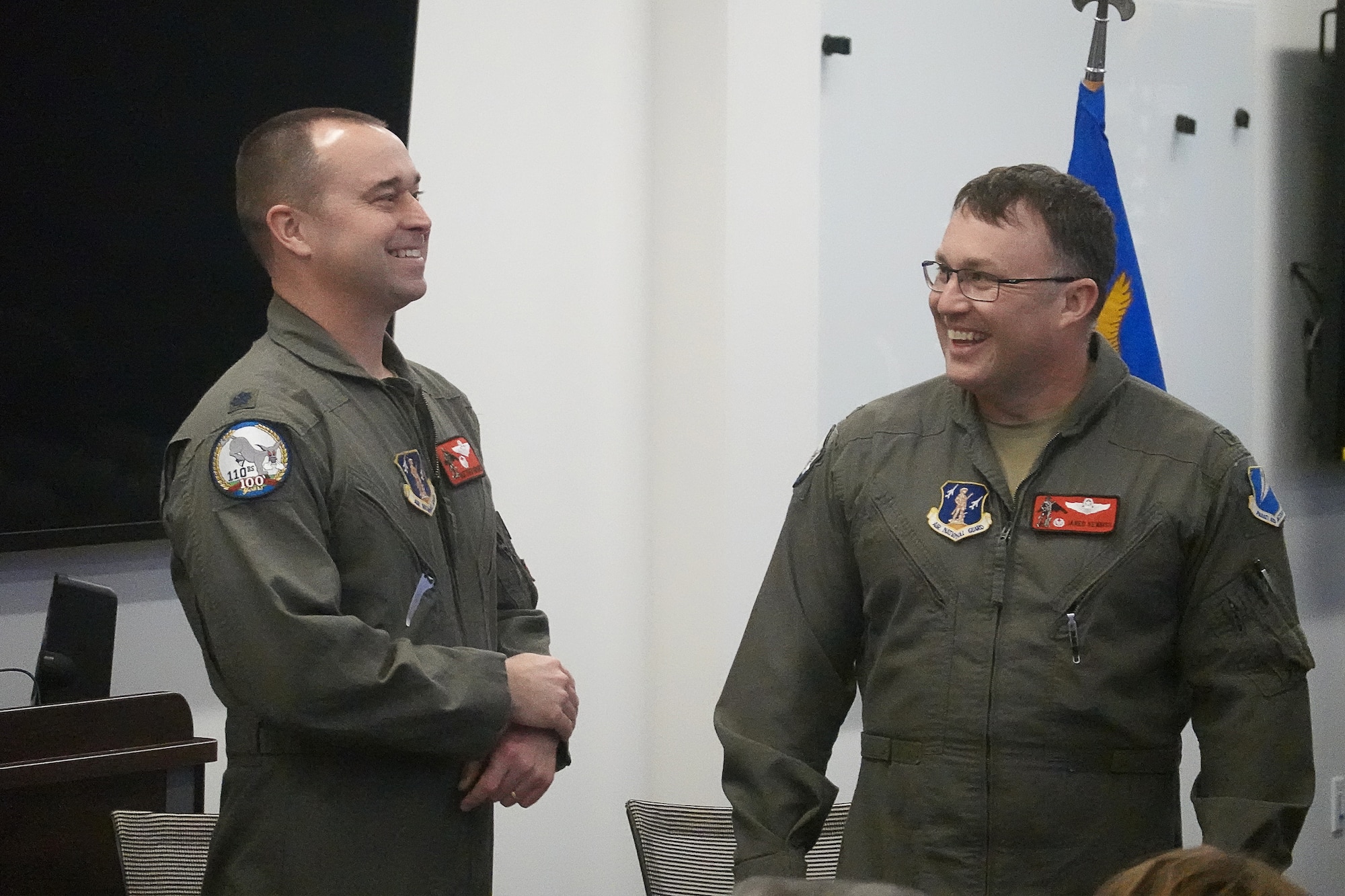 From left, Lt. Col. Matthew Howard, 131st Operations Group commander, and Col. Jared Kennish, 131st Bomb Wing commander, share stories during Howard's Assumption of Command ceremony April 2, 2023, at Whiteman Air Force Base, Missouri. Howard previously served as the 110th Bomb Squadron commander. (U.S. Air National Guard photo by Airman 1st Class Phoenix Lietch)