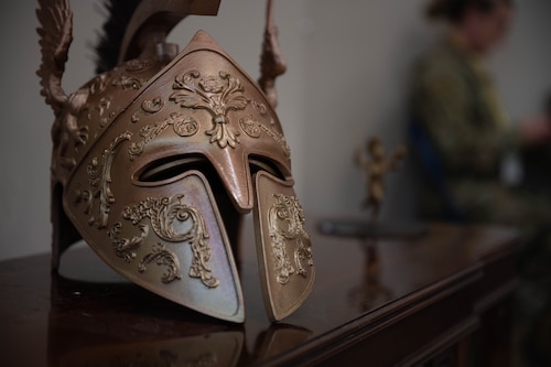 A 3D printed Athenian helmet sits on a table