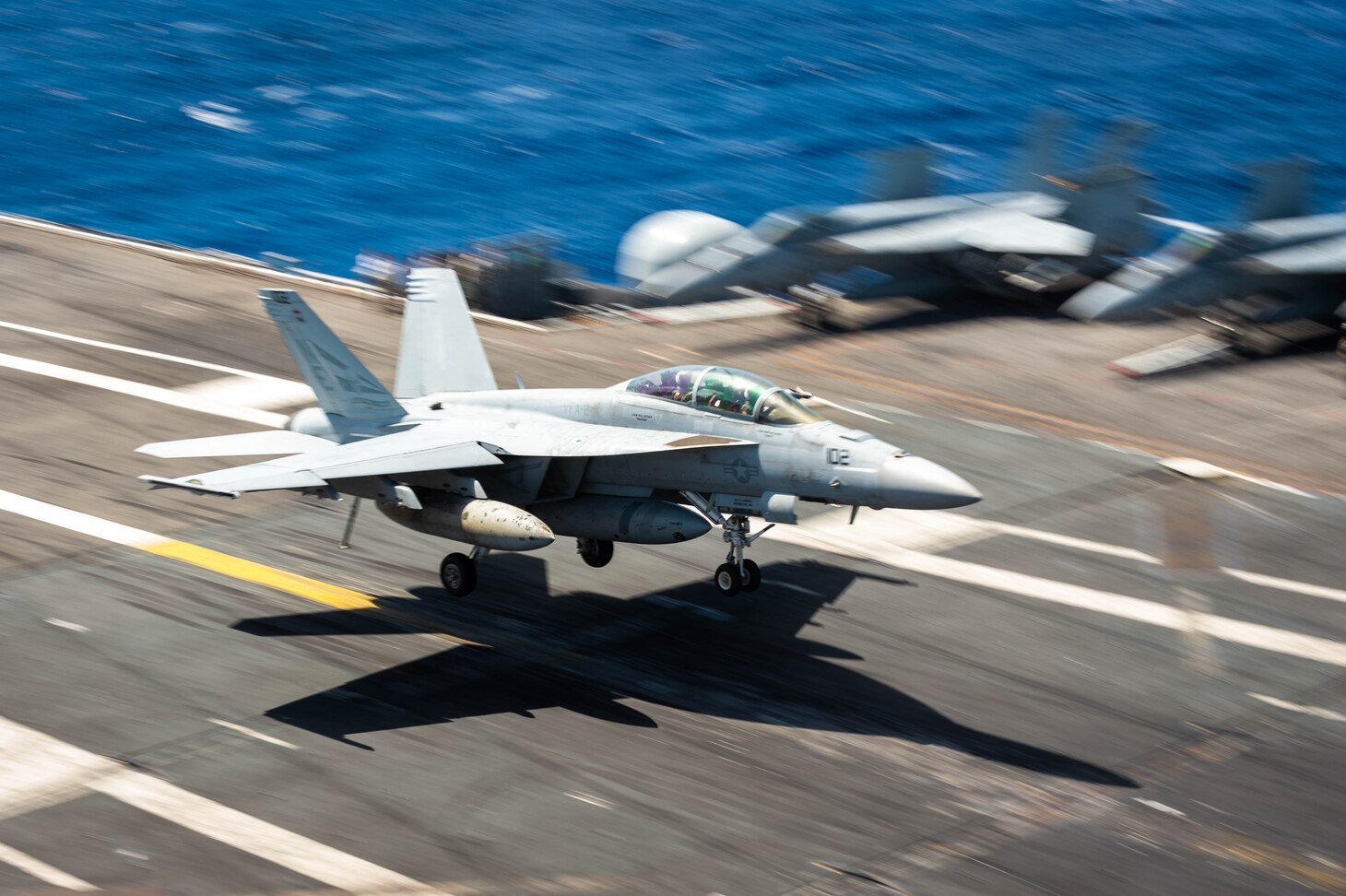 An F/A-18F Super Hornet, assigned to the “Bounty Hunters” of Strike Fighter Squadron (VFA) 2, recovers on the flight deck of the Nimitz-class aircraft carrier USS Carl Vinson (CVN 70).
