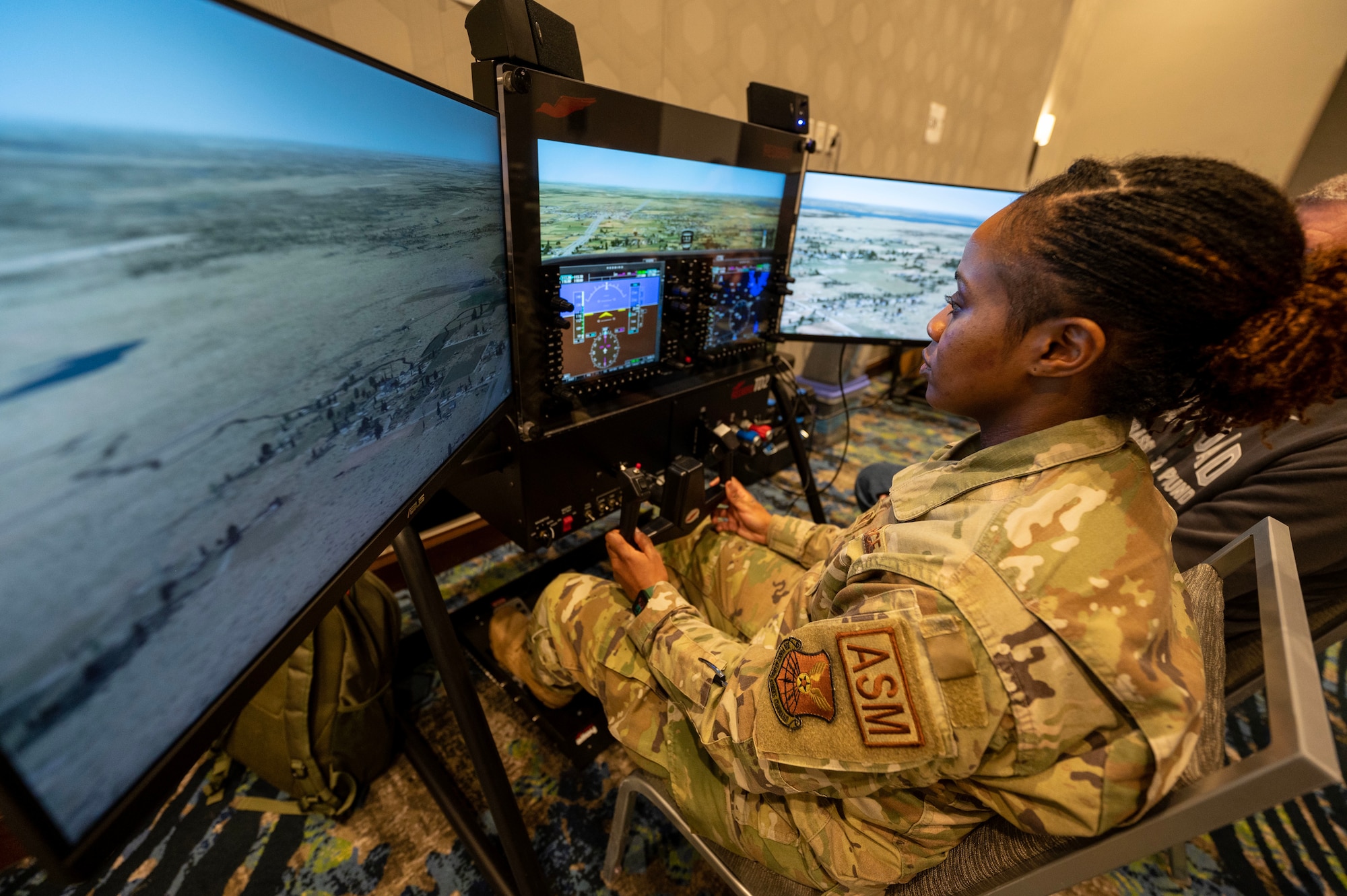 Master Sgt. Careen Lewis, 7th Equipment Maintenance Squadron fabrication flight superintendent, operates a flight simulator