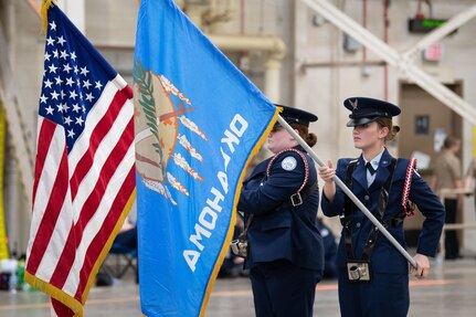 two junior rotc cadets exhibit color guard drill demonstration skills