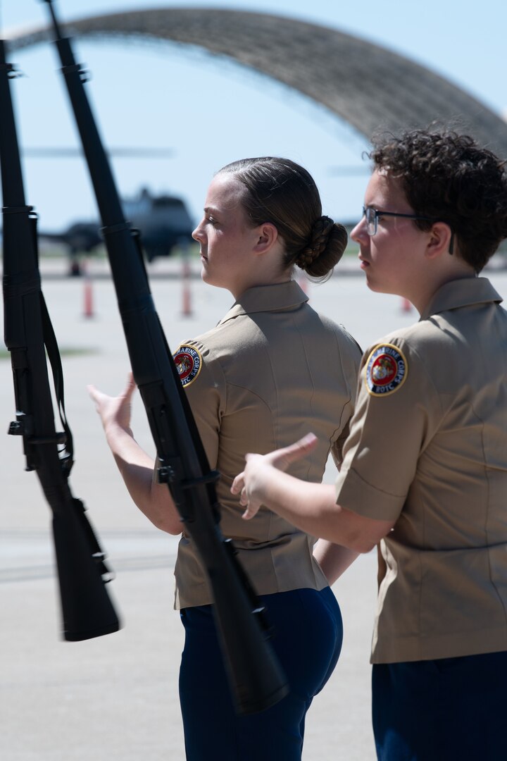 two junior rotc cadets exhibit rifle demonstration skills