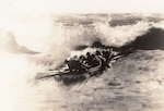 Rare photograph showing a Life-Saving Service boat crew attempting to launch into heavy surf. (Courtesy of Richard Boonisar)