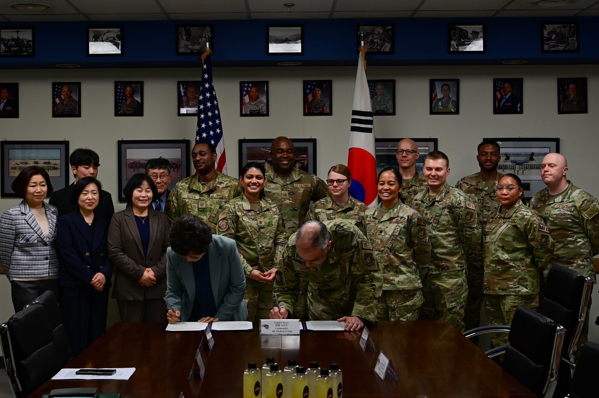 Ms. Sung Nak Yong (left), Gunsan Public Health head and Dr. (Col.) Rene “Hawk” Saenz (right), 8th Medical Group commander, signs a memorandum of understanding (MoU) at Kunsan Air Base, Republic of Korea, Mar. 30, 2023.