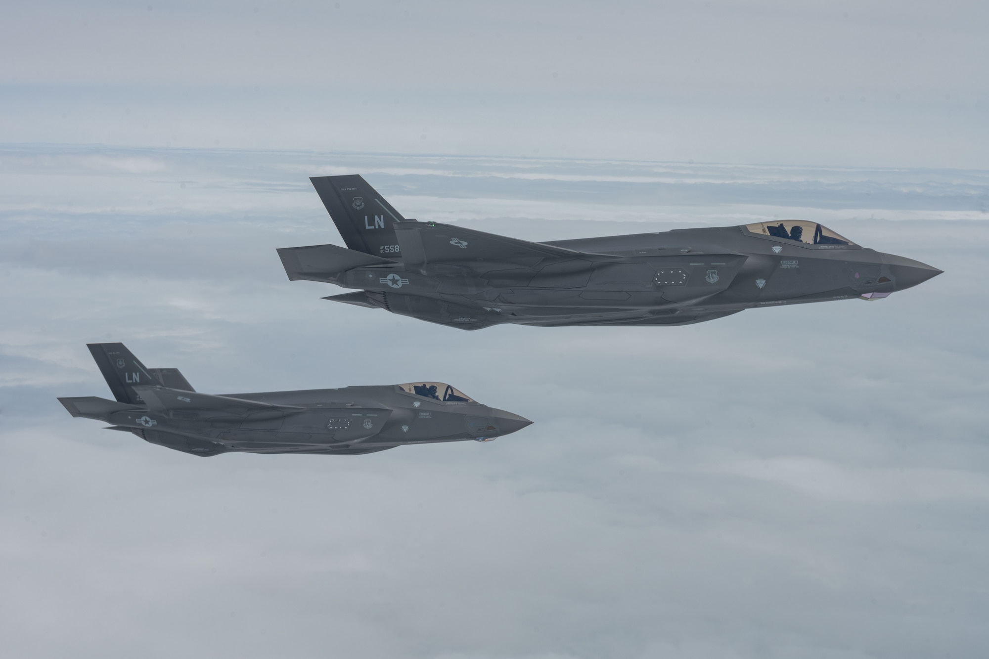 Two U.S. Air Force F-35 Lightning II aircraft assigned to the 48th Fighter Wing prepare for air refueling during a Team Mildenhall media flight over England