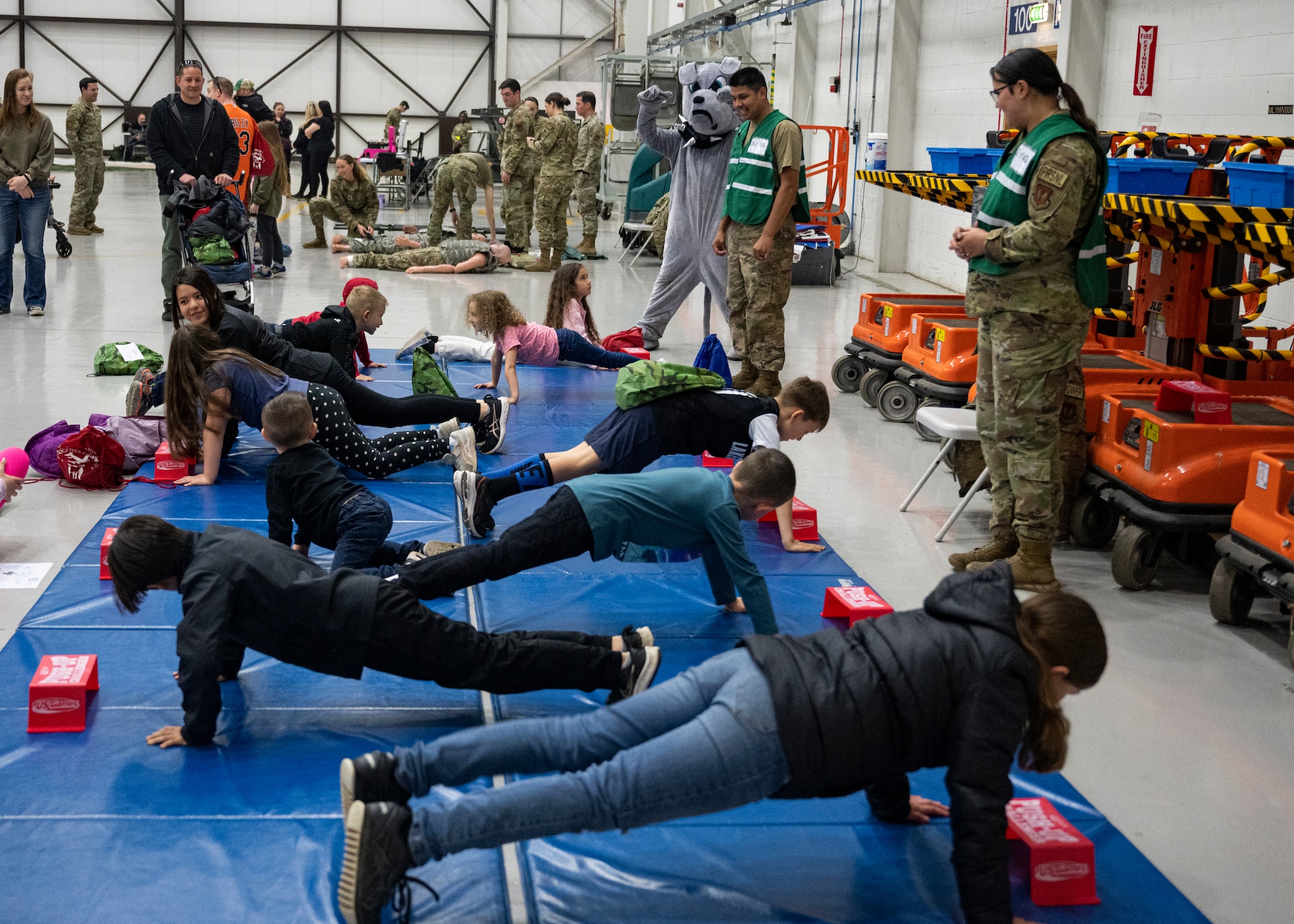 KUDOS is an educational event to help build resilience in military youth by engaging them in activities that simulate the deployment experience.