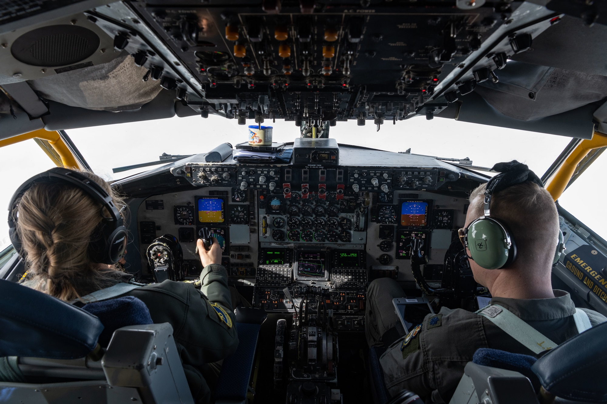 U.S. Air Force Capt. Audrey Springer, left, 351st Air Refueling Squadron KC-135 Stratotanker aircraft commander, and Lt. Col. Mark Watson, U.S. Air Force Europe-UK deputy chief of international relations division, and KC-135 pilot, keep a watchful eye on the controls during a media flight over England