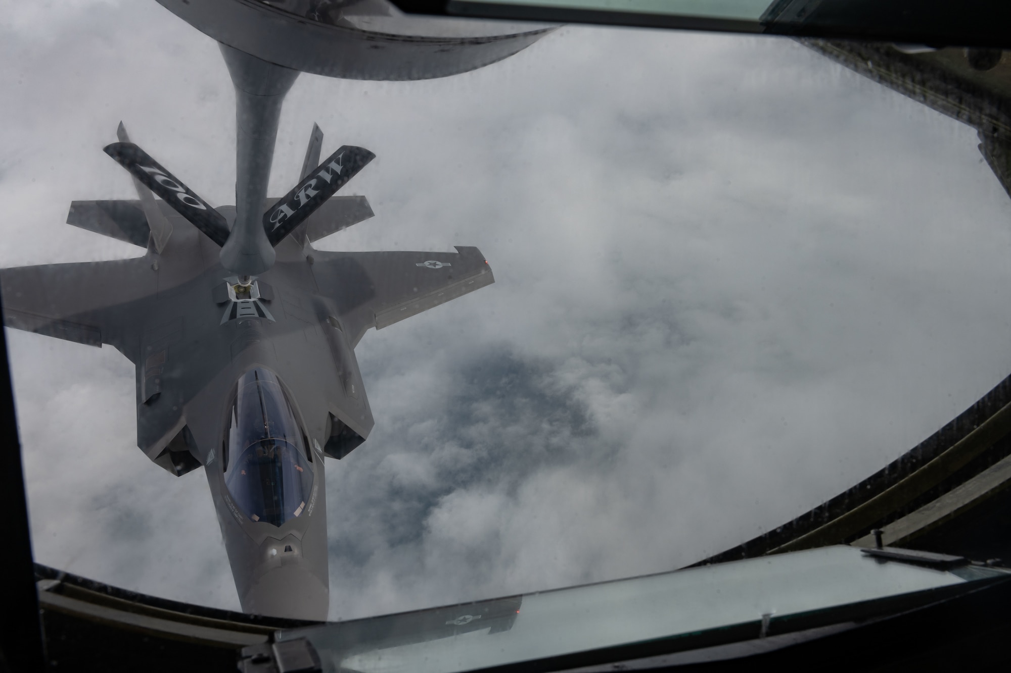 A U.S. Air Force F-35 Lightning II aircraft assigned to the 48th Fighter Wing receives tanker gas during a media flight over England
