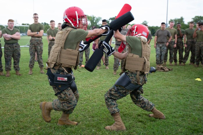 U.S. Marine Corps Pfc. Luciano Giannuzzi, an intelligence specialist with Naval Air Station Oceana Dam Neck and Pfc. Joshua Yum, a data system administrator with Fleet Marine Force, Atlantic, Marine Forces Command, Marine Forces Northern Command, compete in a pugil stick match during a regional field meet at Captain Slade Cutter Park, Virginia, August 5, 2022. Marines across various units competed head-to-head in pugil sticks, ground fighting, PVC pipe construction, flag football, resupply runs, rowing, kickball, and tug-o-war in order to win the command trophy. FMFLANT, MARFORCOM, MARFOR NORTHCOM holds field meets regularly to sustain camaraderie and healthy work relations.