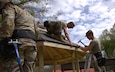 390th Engineer Vertical Construction Company Soldiers tack roofing levels on an improved gazebo at the Brig. Gen. George A. Morris Army Center during Operation Castle Upgrade on 15 March 2023 in Vicksburg, Miss. U.S. Army Reserve photo by Maj. William C. Allred, 412th Theater Engineer Command Deputy Public Affairs Officer.