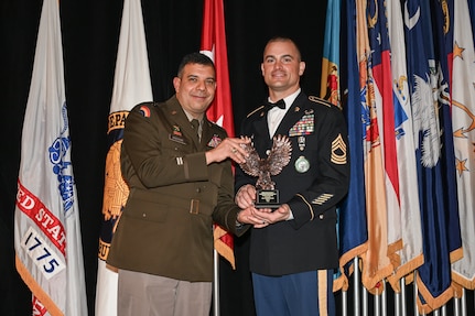 Staff Sgt. Sydney Mapp and Master Sgt. Thomas Clarke Jr., both assigned to the Virginia Army National Guard’s Recruiting and Retention Battalion, are named the second place recruiter, or Director’s 54, and second place section chief in the nation at the Director of the Army National Guard’s Strength Maintenance Conference March 23, 2023, in New Orleans, Louisiana. (U.S. National Guard photo by Sgt. 1st Class Jon Soucy)