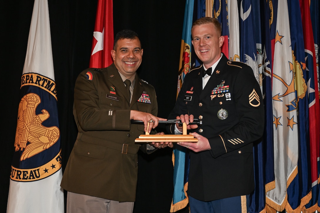 Staff Sgt. Sydney Mapp and Master Sgt. Thomas Clarke Jr., both assigned to the Virginia Army National Guard’s Recruiting and Retention Battalion, are named the second place recruiter, or Director’s 54, and second place section chief in the nation at the Director of the Army National Guard’s Strength Maintenance Conference March 23, 2023, in New Orleans, Louisiana. (U.S. National Guard photo by Sgt. 1st Class Jon Soucy)