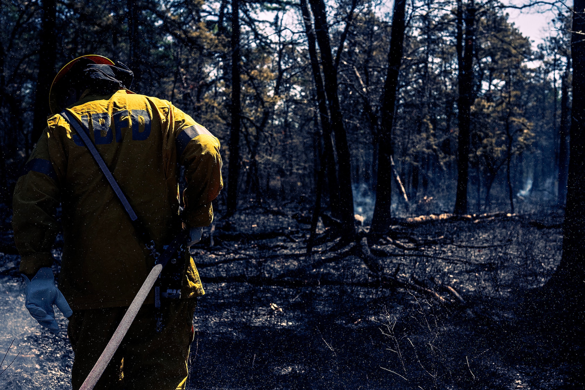 A photo of Joint Base McGuire-Dix-Lakehurst firefighters doing the mop-up phase of a major wildfire.