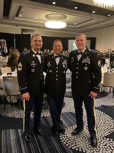 Master Sgt. Thomas Clarke Jr. (left); Sgt. Maj. Paul Johnson (center), senior enlisted leader for the Virginia Army National Guard’s Recruiting and Retention Battalion; and Staff Sgt. Sydney Mapp (right) pose together at the Director of the Army National Guard’s Strength Maintenance Conference March 23, 2023, in New Orleans, Louisiana.