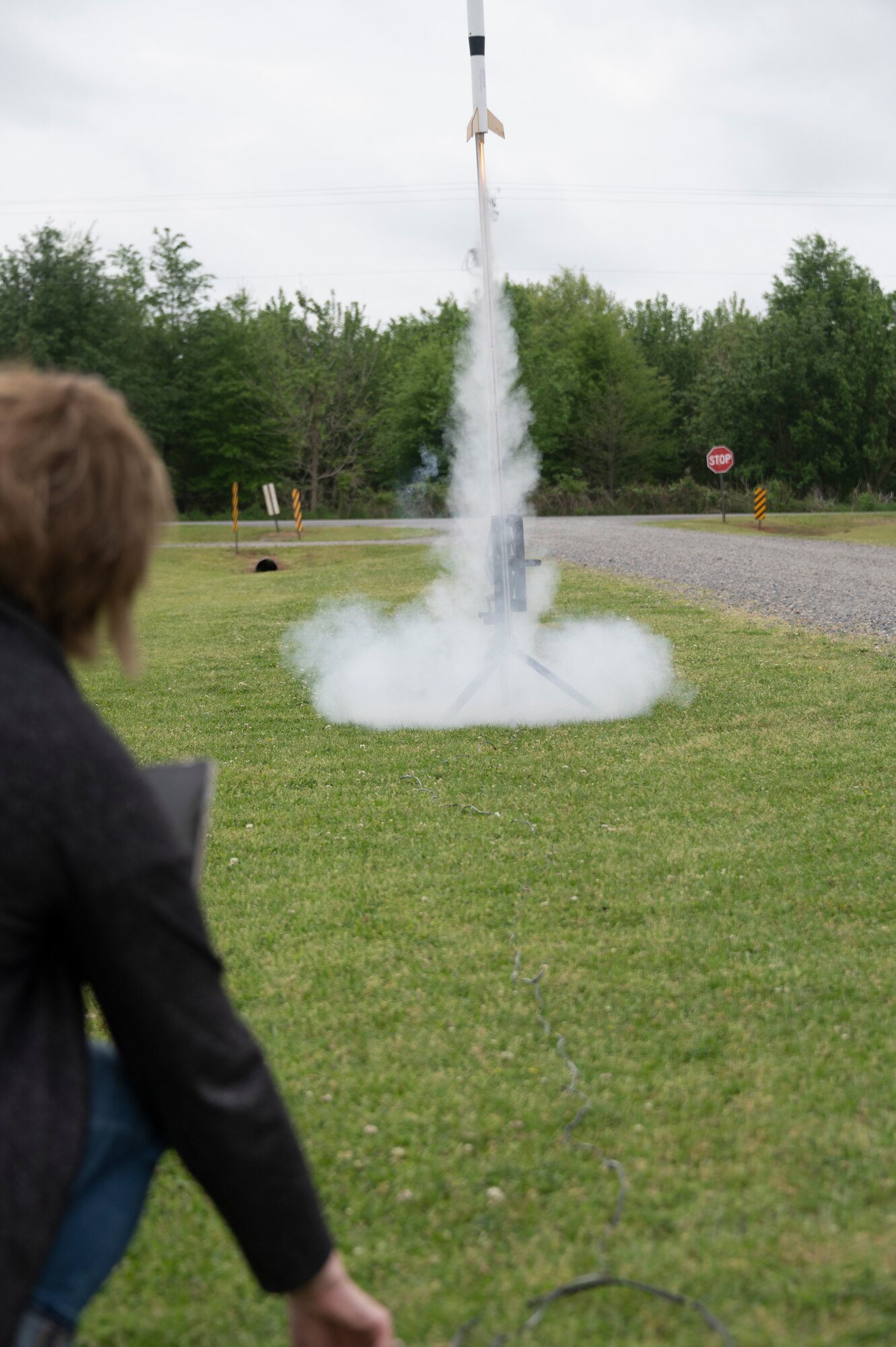 Photo of person launching a model rocket