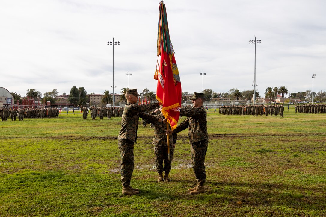 U.S. Marine Corps Col. Ryan E. Scott, outgoing commanding officer of Combat Logistics Regiment 1, 1st Marine Logistics Group, relinquishes command to oncoming commanding officer Col. Prescott N. Wilson during a change of command ceremony on Camp Pendleton, Calif., Jan. 12, 2023. The Combat Logistics Regiment 1 change of command ceremony marked the passing of command from Col. Ryan E. Scott to Col. Prescott N. Wilson. (U.S. Marine Corps photo by Lance Cpl. Bradley Ahrens)