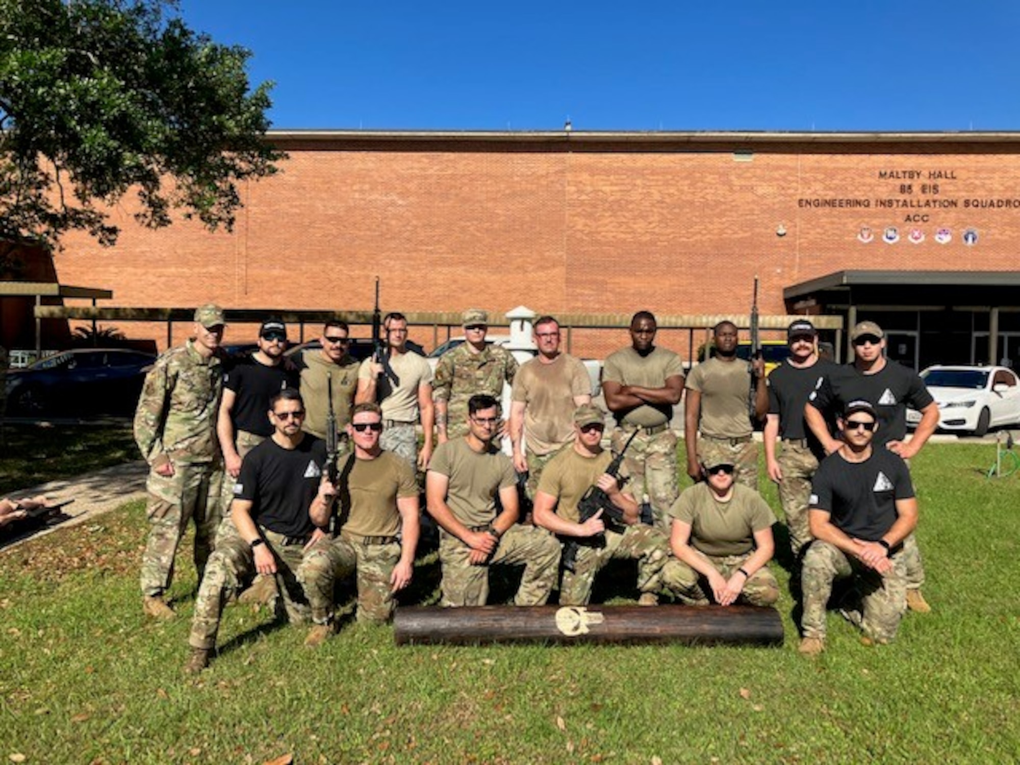 Courtesy photo of members from the 85th Engineering Installation Squadron and the 5th Combat Communications Support Squadron posing for photo in the first combat readiness course at Keesler, on April 14, 2023. In this course 85th EIS students learn weapons familiarization, combatives and other pre-deployment tactics. (Courtesy photo)