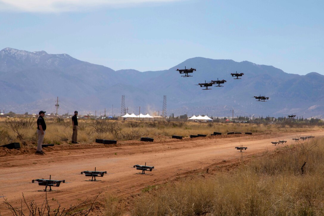 Unmanned aerial systems take off on a dirt road.