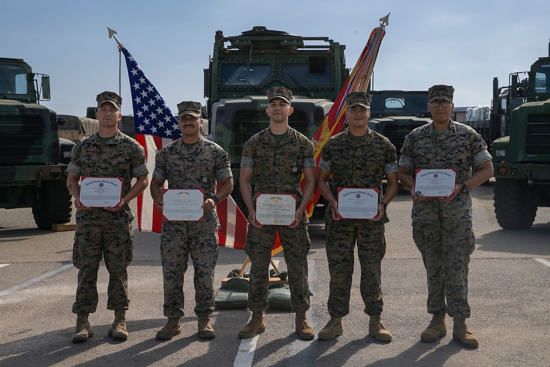 U.S. Marines with Combat Logistics Regiment 17, 1st Marine Logistics Group, pose for a group photo after a Road Warrior Awards ceremony on Camp Pendleton, California, July 26, 2022. As part of the 1st MLG Safety Program, the Road Warrior Awards recognize individuals and units who set the example in operational safety and mishap prevention. (U.S Marine Corps photo by Lance Cpl. Kristy Ordonez Maldonado)