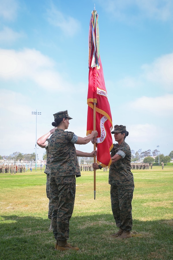 U.S. Marine Corps Lt. Col. Melina Mesta, outgoing commanding officer of 7th Engineer Support Battalion, passes the colors to on coming commanding officer Lt. Col. Sarah R. Culbertson during a change of command ceremony on Camp Pendleton California, June 15, 2022. The 7th ESB change of command ceremony marked the passing of command from Lt. Col. Melina Mesta to Lt. Col. Sarah Culbertson. (U.S. Marine Corps photo by Sgt. Maximiliano Rosas)