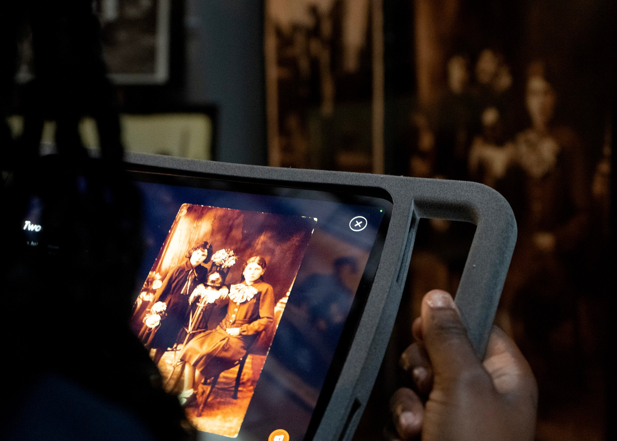 An Airmen assigned to 70th Intelligence, Surveillance and Reconnaissance Wing listens to a personal story in the “Tower of Faces” during a tour at the U.S. Holocaust Memorial Museum, Washington D.C., April 17, 2023. The "Tower of Faces" exhibit consists of approximately 1,000 reproductions of prewar photographs of Jewish life gathered from more than 100 families. Airmen gained insight of what life was like for Jewish people before, during and after World War II, providing a unique experience tailored to informing them of the details surrounding the Holocaust. (U.S. Air Force photo by Staff Sgt. Kevin Iinuma)