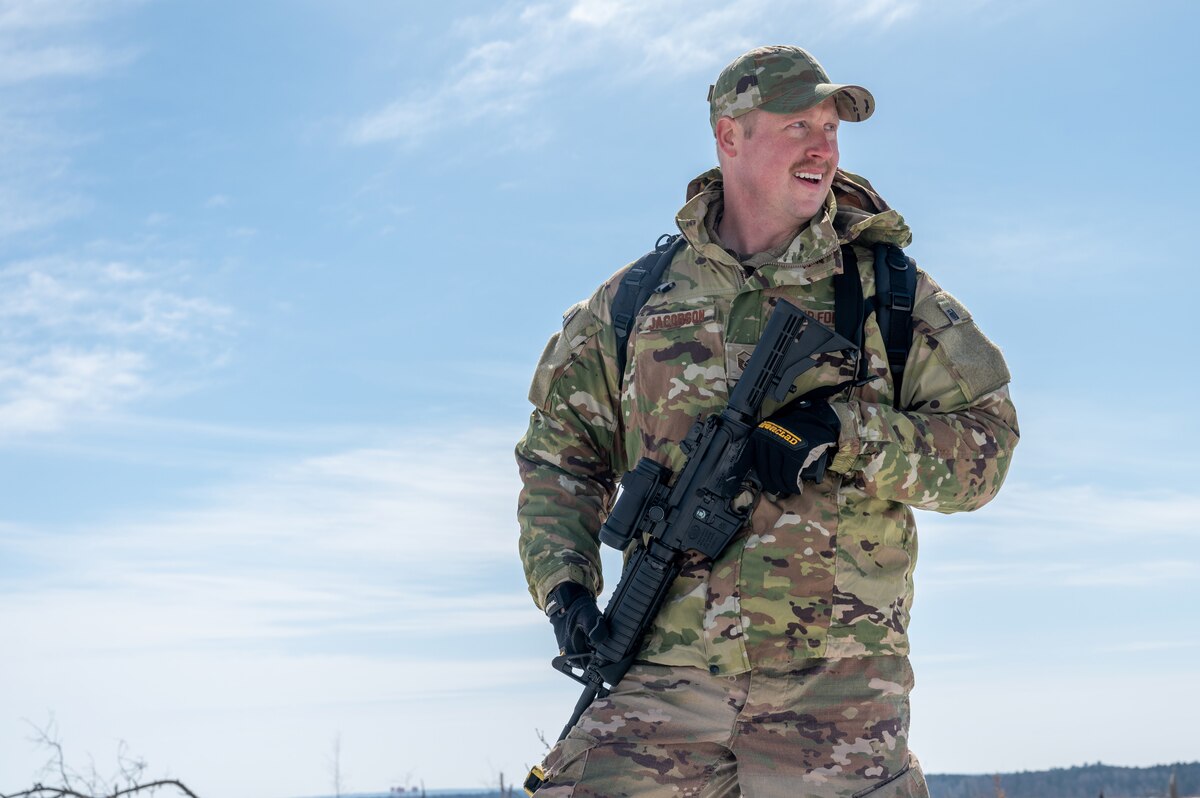 Master Sgt. Thomas Jacobson, a 934th Civil Engineering Squadron plumber, looks over the horizon during a land navigation exercise at Camp Ripley, Minnesota, on April 2, 2023. The 934 CES conducted a field training exercise, including land navigation and general tent setup (U.S. Air Force photo by Senior Airman Matthew Reisdorf)