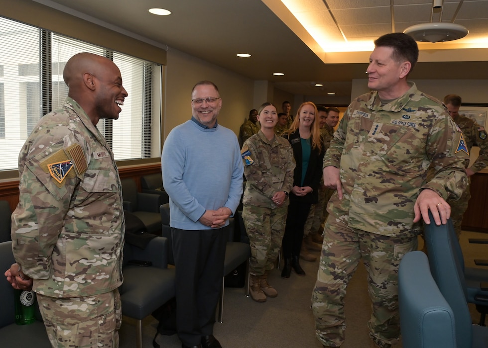 U.S. Space Force Gen. David D. Thompson, Vice Chief of Space Operations, recognized U.S. Air Force Tech. Sgt. Brian Murphy, Space Launch Delta 30 Inspector General planner, with a commander’s coin