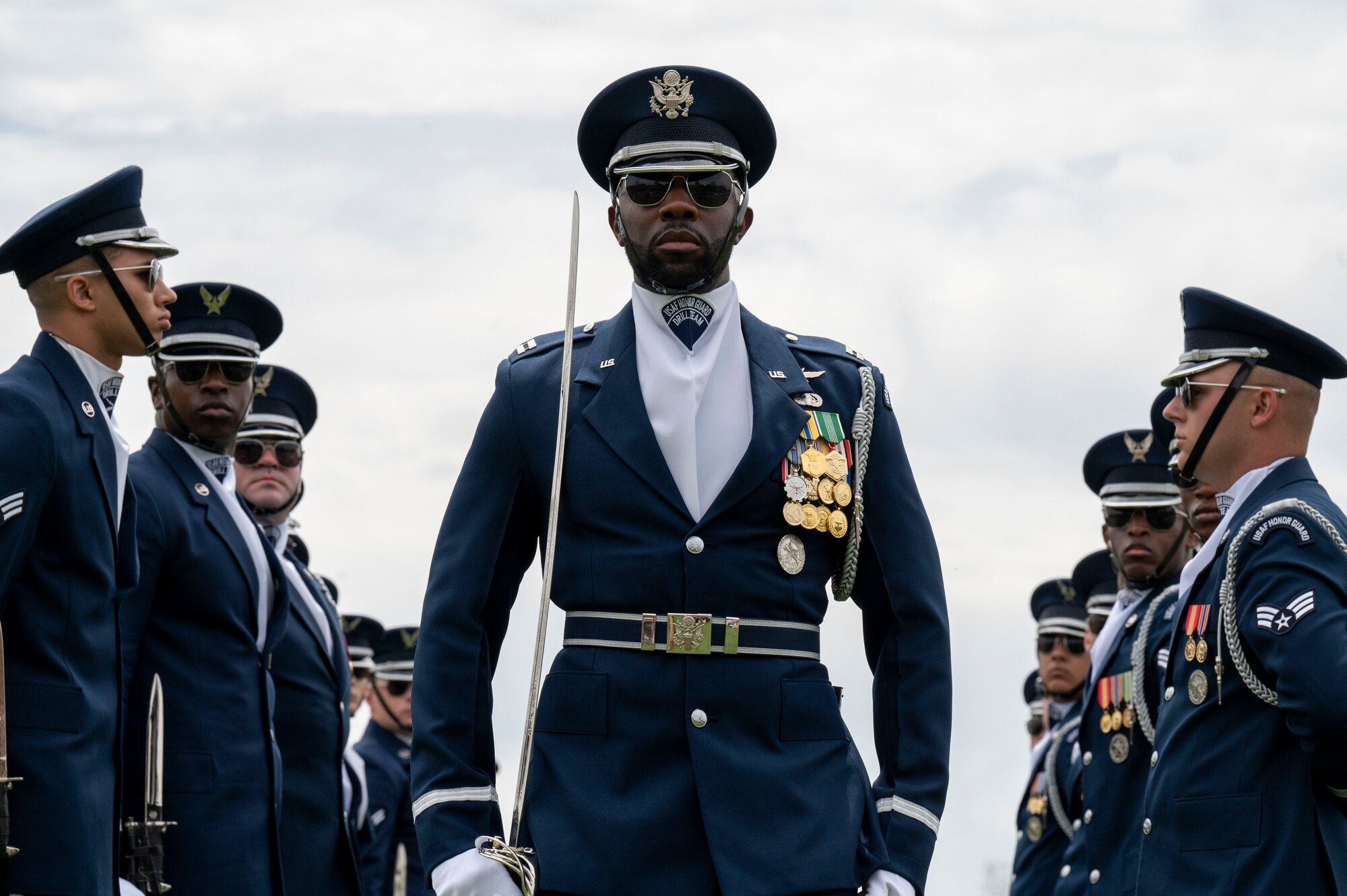 U.S. Air Force Capt. Brian Johnson of the U.S. Air Force Honor Guard Drill Team completes the gauntlet during a performance at the Joint Services Drill Exhibition, April 14, 2023, Washington Monument, Washington, D.C. The Drill Team is an elite unit of 25 Airmen who train, on average, five days a week for eight to ten hours per day to obtain their level of mastery. (U.S. Air Force photo by Kristen Wong)