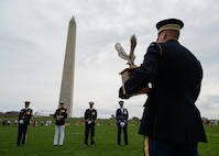U.S. Army Col. David B. Rowland, commander of 3d U.S. Infantry Regiment (The Old Guard), awaiting to announce the winner of the Joint Services Drill Exhibition, April 14, 2023, at the Washington Monument, Washington, D.C. The event brought together drill teams from the U.S. Air Force, Army, Navy, Marine Corps and Coast Guard to compete for the most superlative display of precision, discipline and teamwork. (U.S. Air Force photo by Airman 1st Class Bill Guilliam)